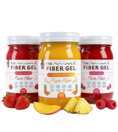 Three jars of 'The Fiber Gel' with strawberry, mango & pineapple, and raspberry flavors on a white background.